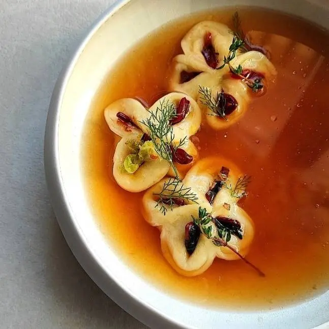 creation thumb for Modern Gyoza with winter vegetables and pork, in Miso broth.