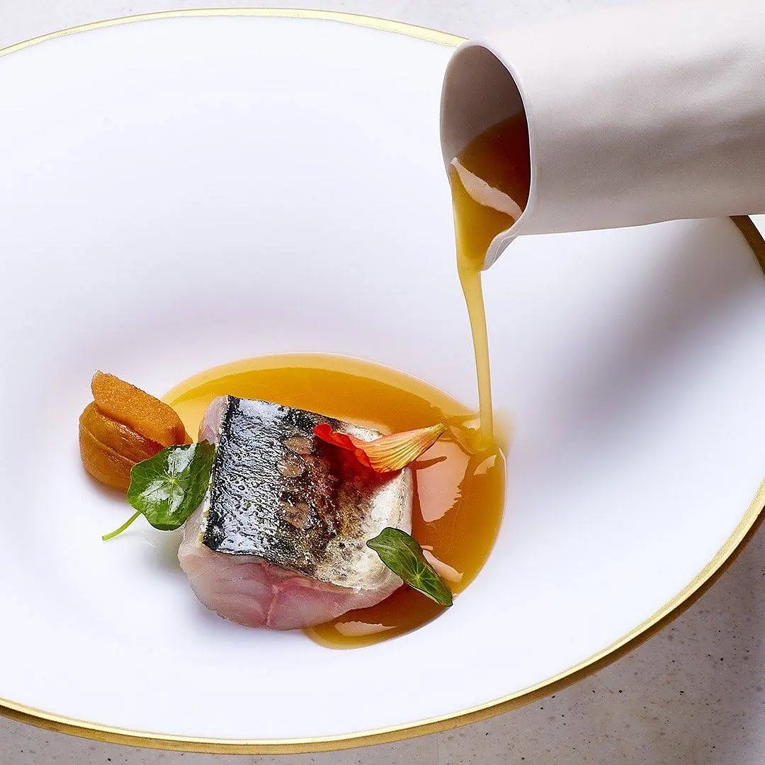 creation thumb for Xarda a la brasa with roasted tomato, mustard & nasturtiums