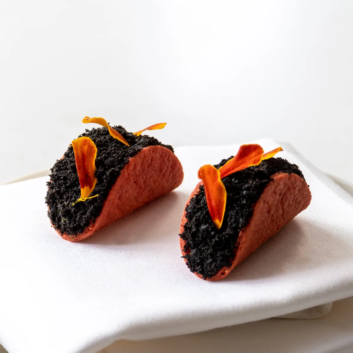 Tomato taco with black olive crumble & avocado salad