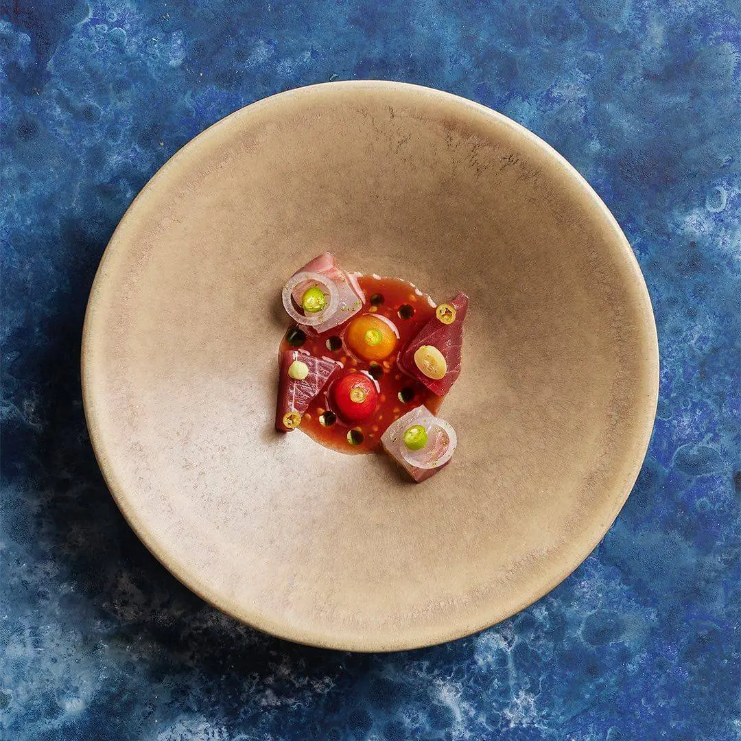 creation thumb for Aged sea bream, tuna, onion, tomatoes, mandarin leaf oil