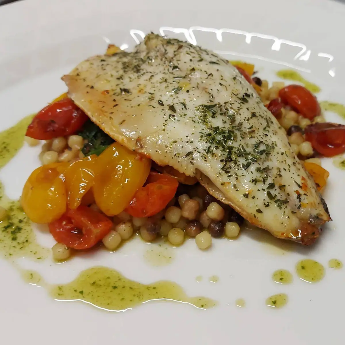creation thumb for Branzino with Sardinian fregula, spinach in butter and cherry tomatoes