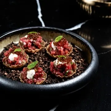 creation thumb for Beef Tartare/ pomegranate molasses caviar/ aioli 