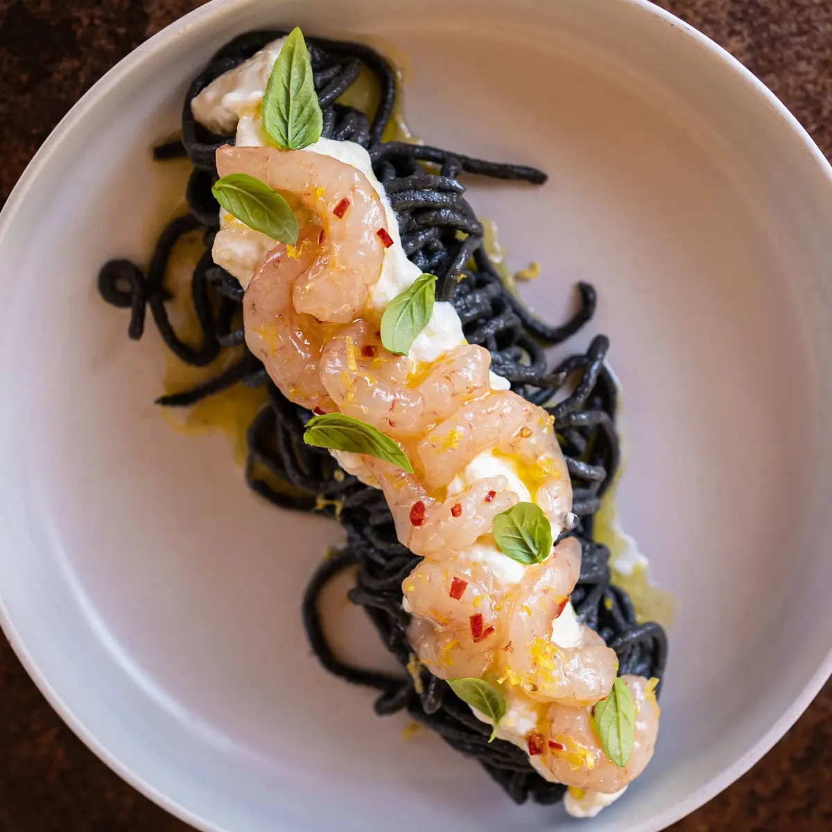 creation thumb for Squid ink spaghetti with pink prawns, stracciatella & basil