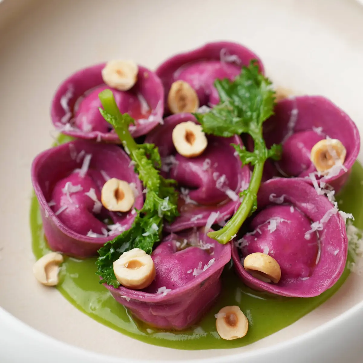 Smoked burrata and beetroot tortelli with cime di rapa