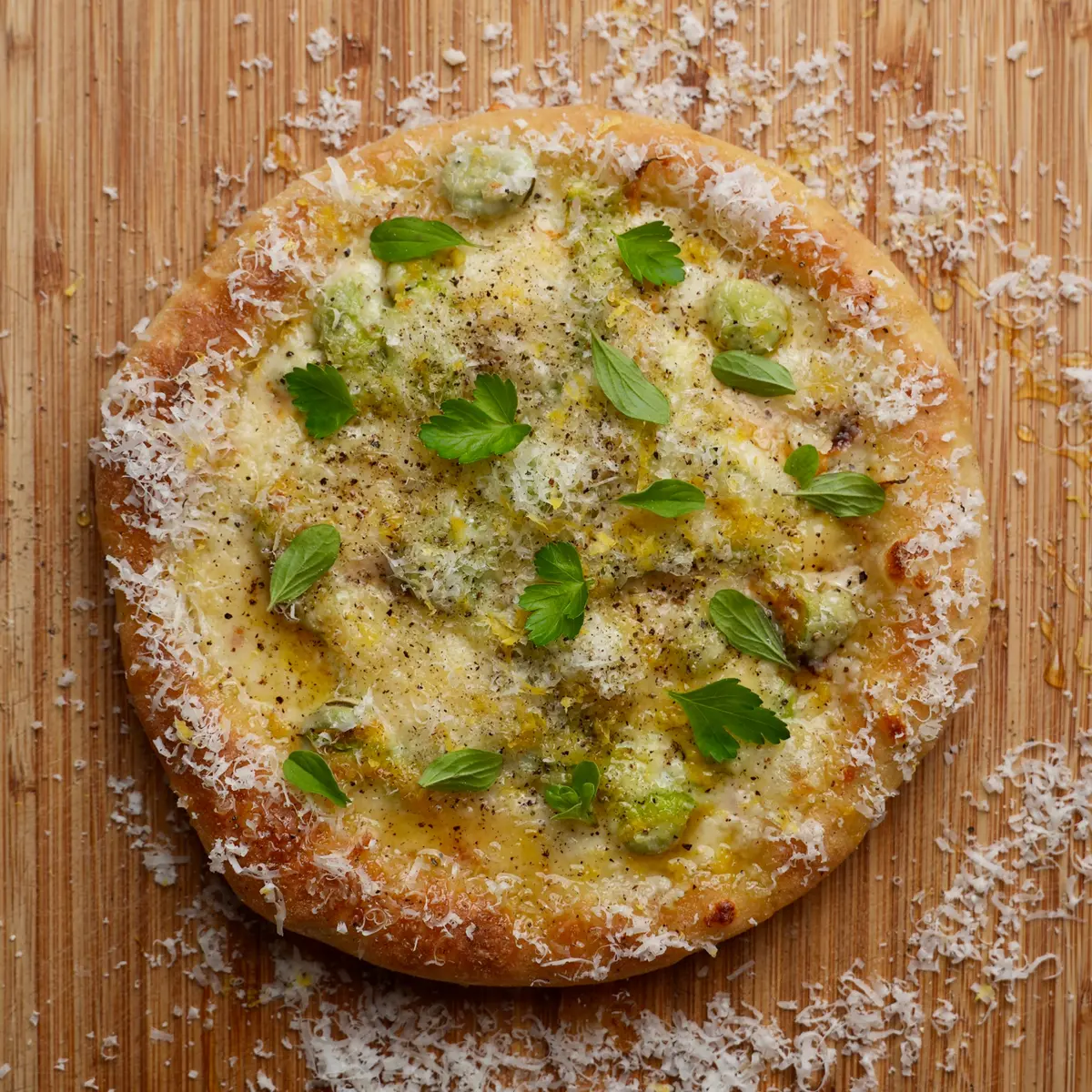 creation thumb for Frying Pan Pizza Cheese, Broad Beans, Black Pepper & Honey