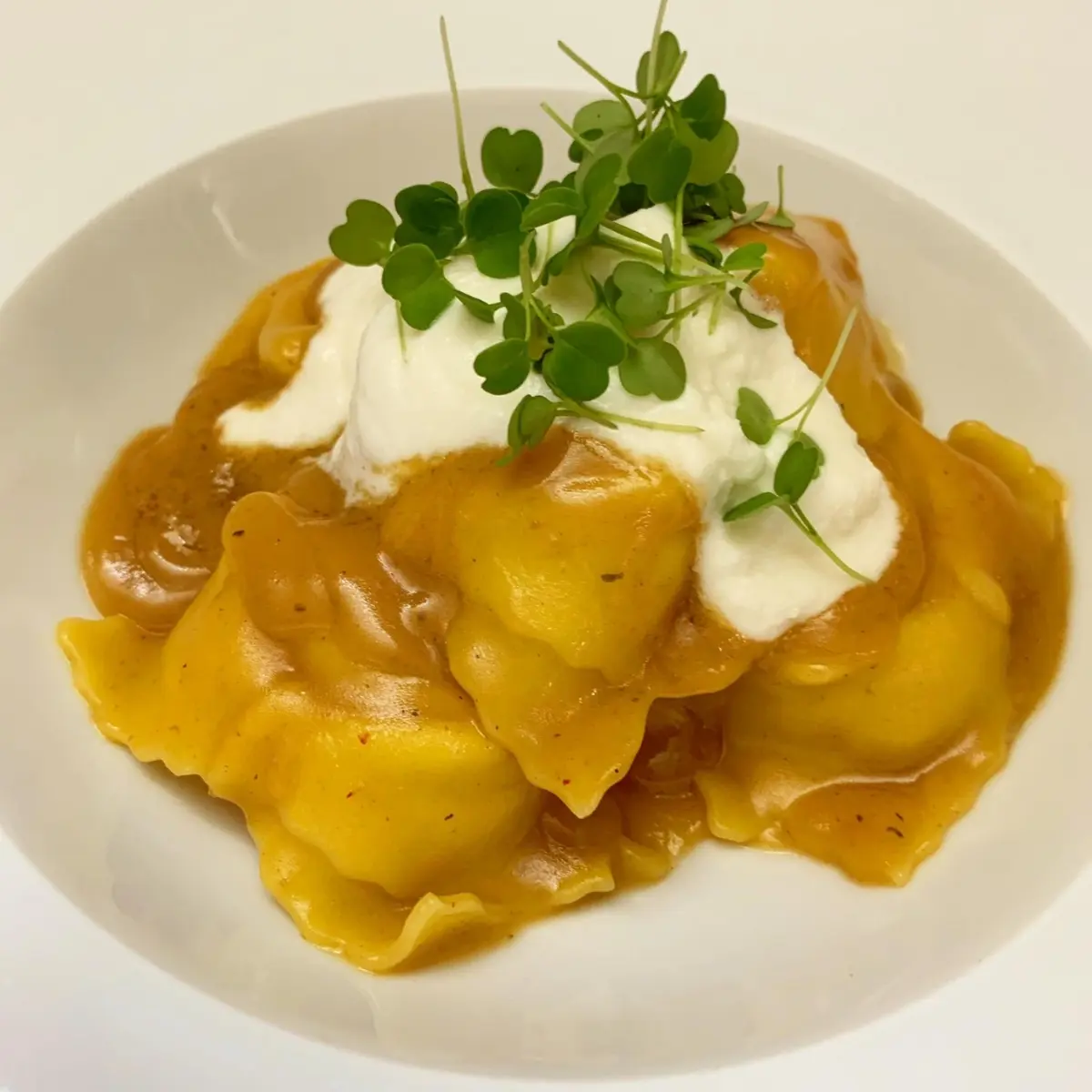 creation thumb for Ravioli filled with Burrata cheese and prans bisque.