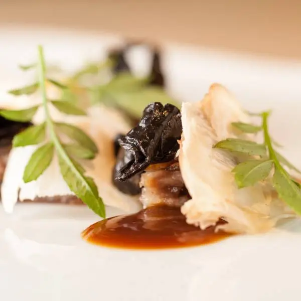 creation thumb for Glazed tail, with mushrooms and black truffle.