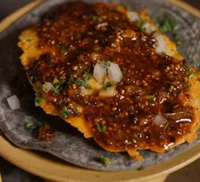 A tostada topped with salsa macha
