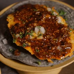 A tostada topped with salsa macha
